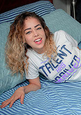 Kataljna Kittin on the bed ready to jerk cock